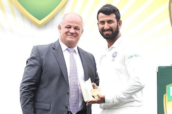 Pujara (right) top scored in the first essay.